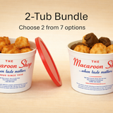 Two tubs from The Macaroon Shop with red lids on a beige background